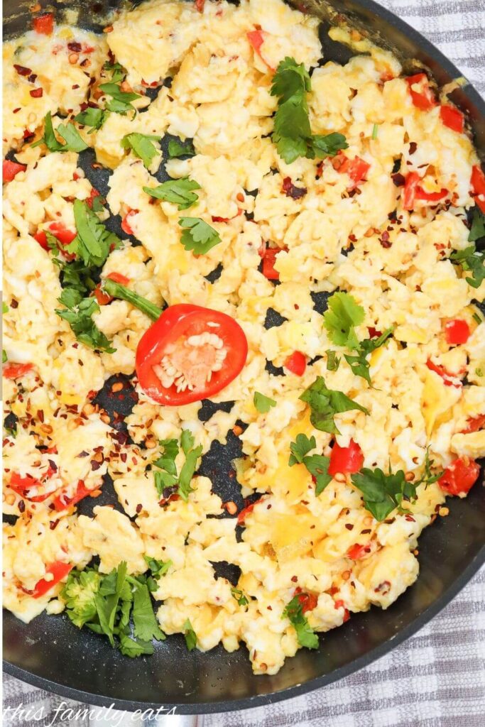 red pepper scrambled eggs in pan