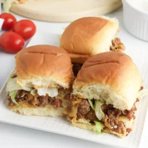 Taco Sliders with Hawaiian rolls on a plate.