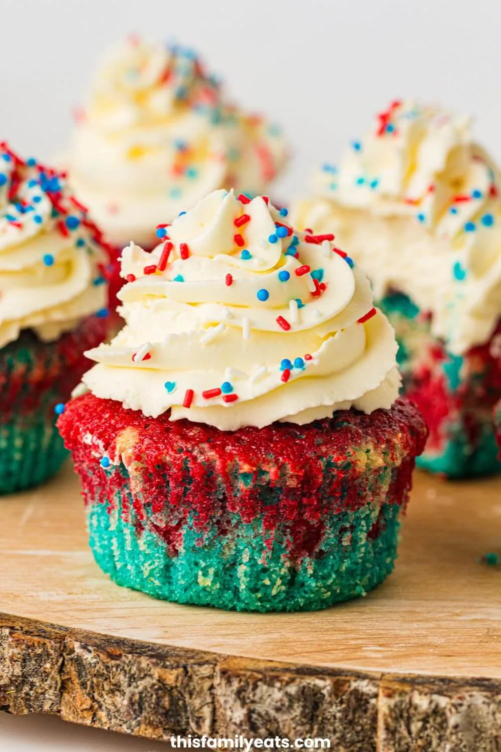 Patriotic cupcakes with icing and red white and blue sprinkles.