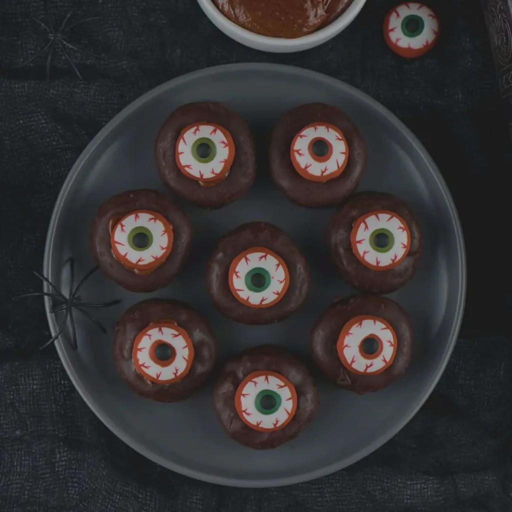 Plate of min eyeball donuts for Halloween.