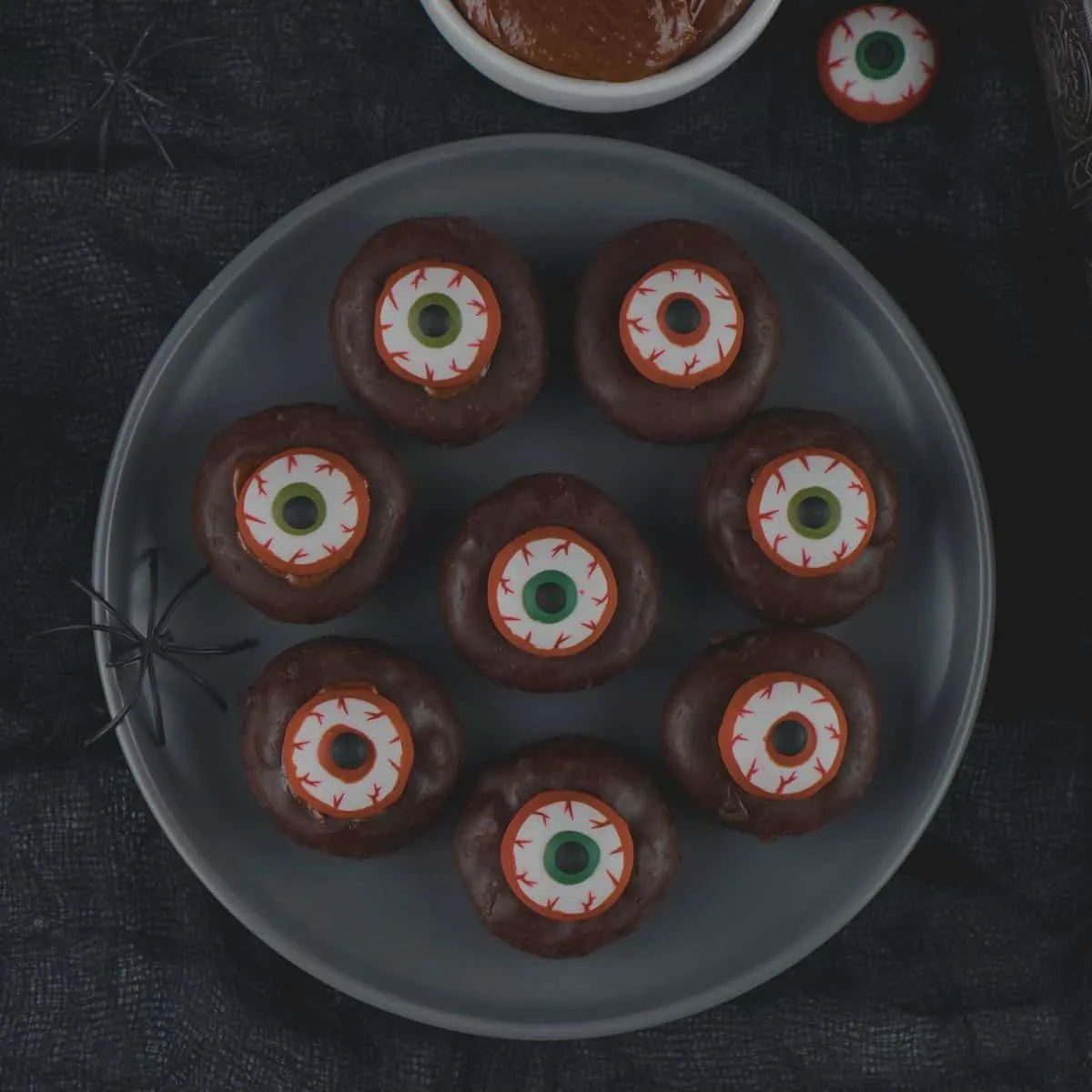 Plate of min eyeball donuts for Halloween.